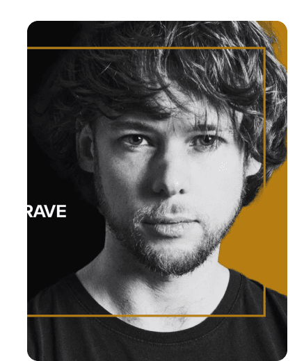 Black-and-white portrait of a man with curly hair on an NGRAVE-branded backdrop