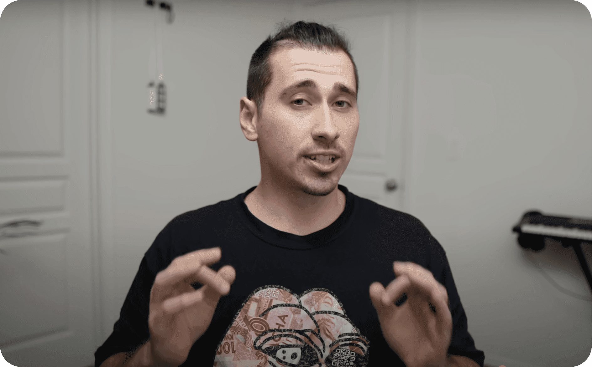 Video thumbnail of a man in a black graphic T-shirt talking to the camera