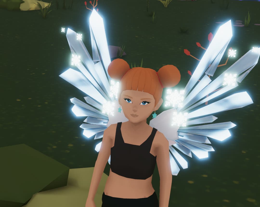 Metaverse avatar with orange hair buns wearing large glowing crystal wings