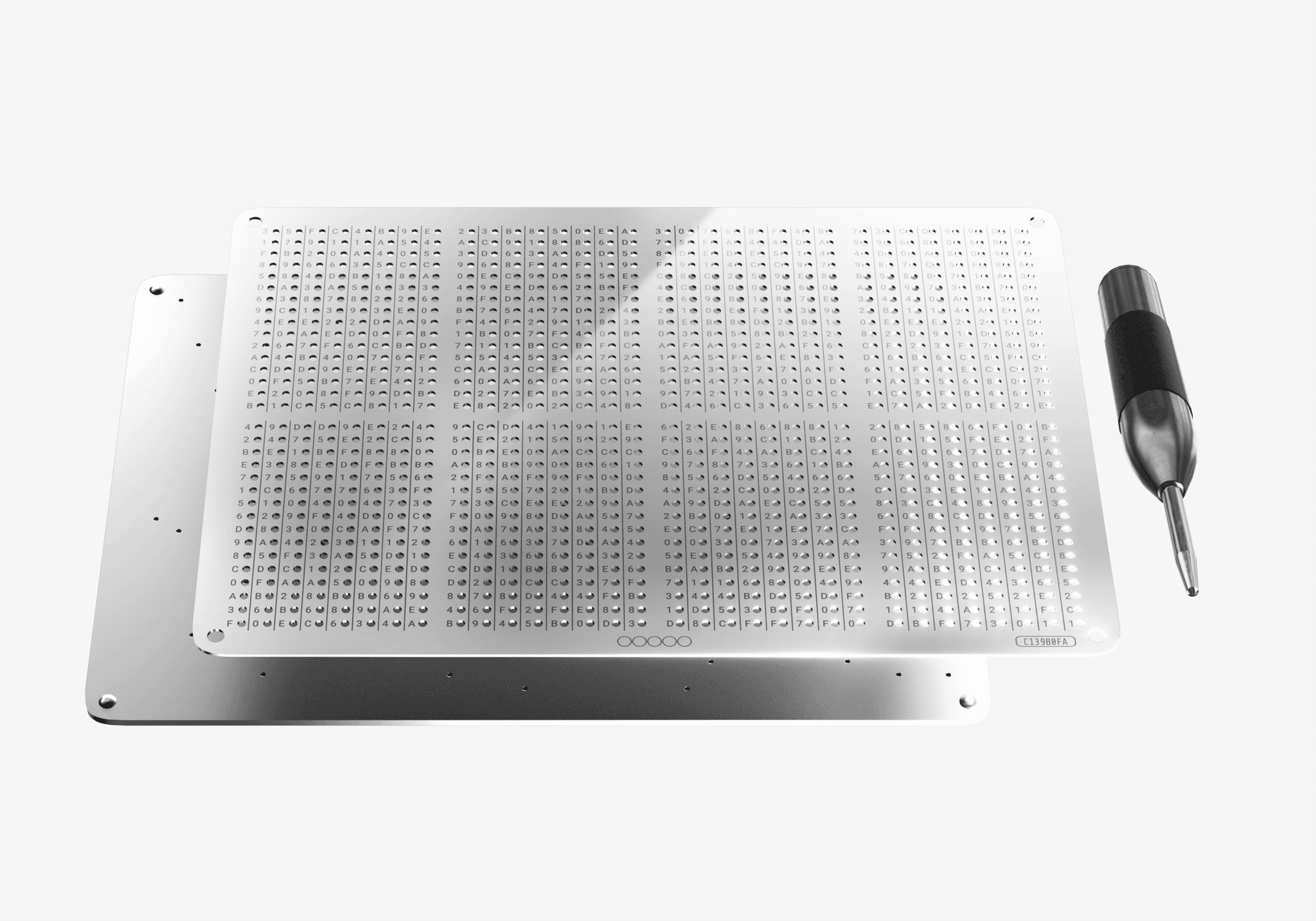 Two NGRAVE GRAPHENE stainless steel backup plates with the punch tool used to mark your key