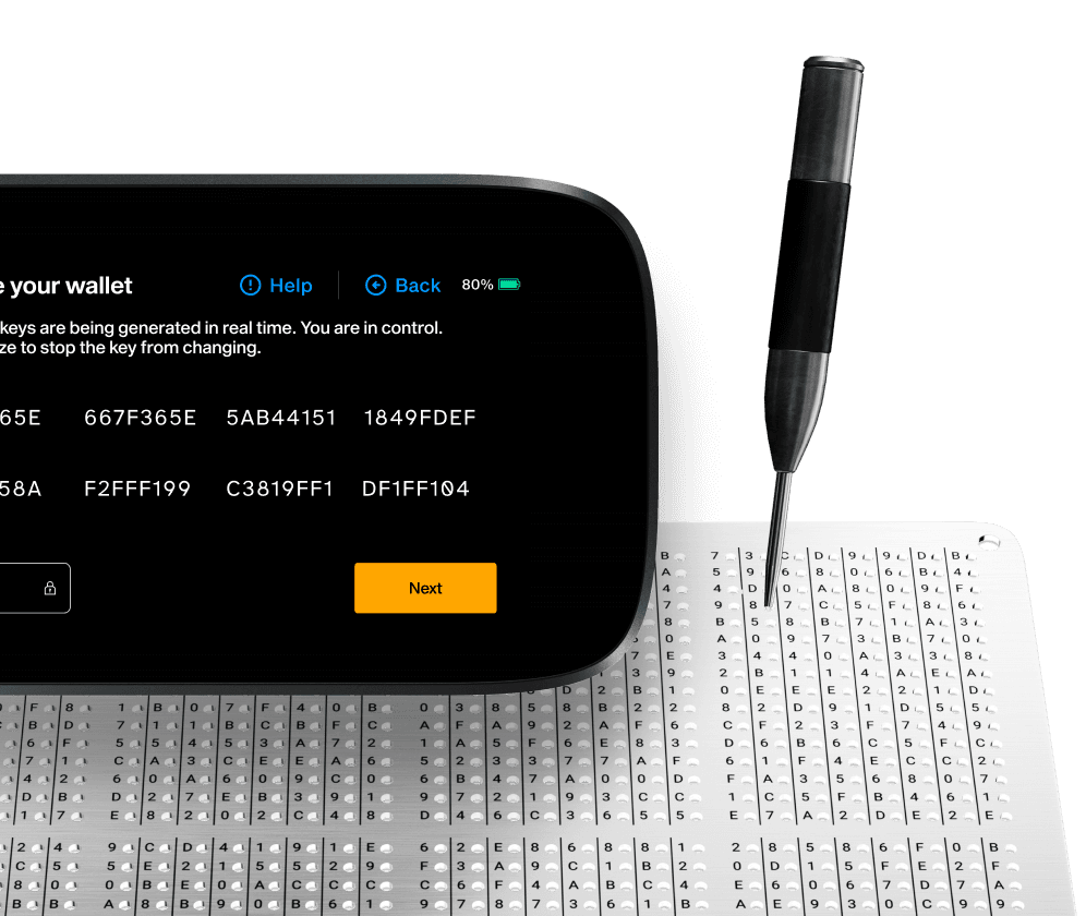 NGRAVE ZERO showing a generated key in hex while a punch marks it into a GRAPHENE steel plate